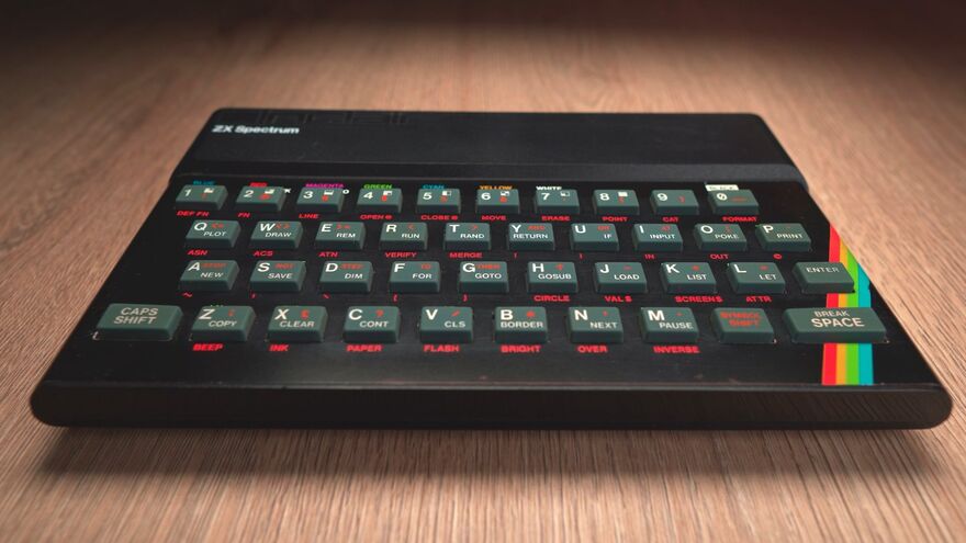 The ZX Spectrum on a wooden table top. 