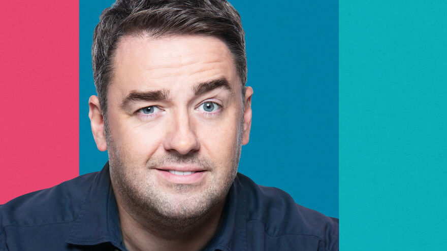 Jason Manford, a white man with blue eyes, raising his eyebrow